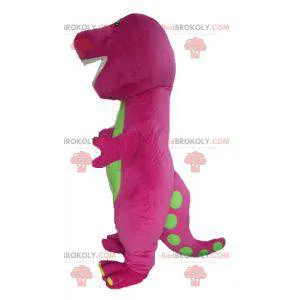 Plump and funny giant pink and green dinosaur mascot -