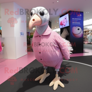 Pink Guinea Fowl mascot costume character dressed with a Long Sleeve Tee and Shoe laces