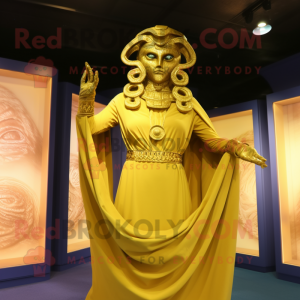 Gold Medusa mascot costume character dressed with a Shift Dress and Shawl pins