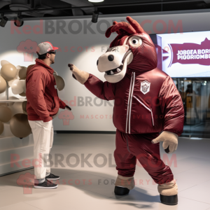 Maroon Quagga mascot costume character dressed with a Bomber Jacket and Messenger bags