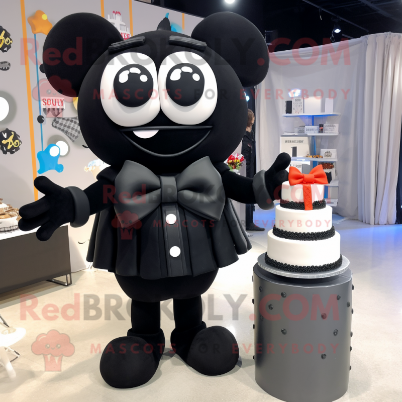 Black Wedding Cake mascot costume character dressed with a Sweatshirt and Bow ties Black Wedding Cake mascot costume character dressed with a Sweatshirt and Bow ties