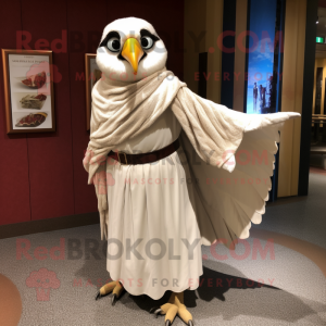 Cream Falcon mascot costume character dressed with a Empire Waist Dress and Shawl pins