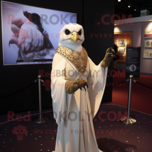 Cream Falcon mascot costume character dressed with a Empire Waist Dress and Shawl pins