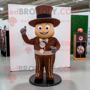 Brown Ring Master mascot costume character dressed with a Jumpsuit and Hat pins