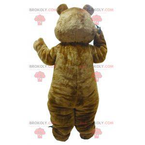 Mascota de oso de peluche marrón y blanco con garras -