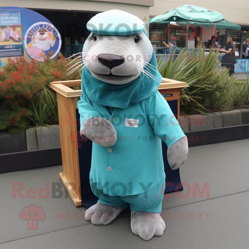 Teal Sea Lion mascot costume character dressed with a Cardigan and Hat pins