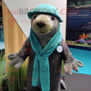 Teal Sea Lion mascot costume character dressed with a Cardigan and Hat pins