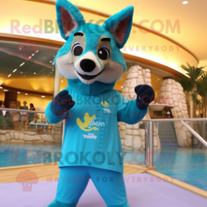 Turquoise Dingo mascot costume character dressed with a Swimwear and Bracelets