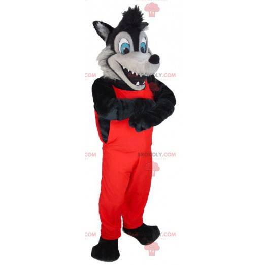 Mascotte de loup noir et gris en salopette rouge -