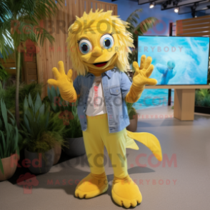 Yellow Betta Fish mascot costume character dressed with a Chambray Shirt and Foot pads