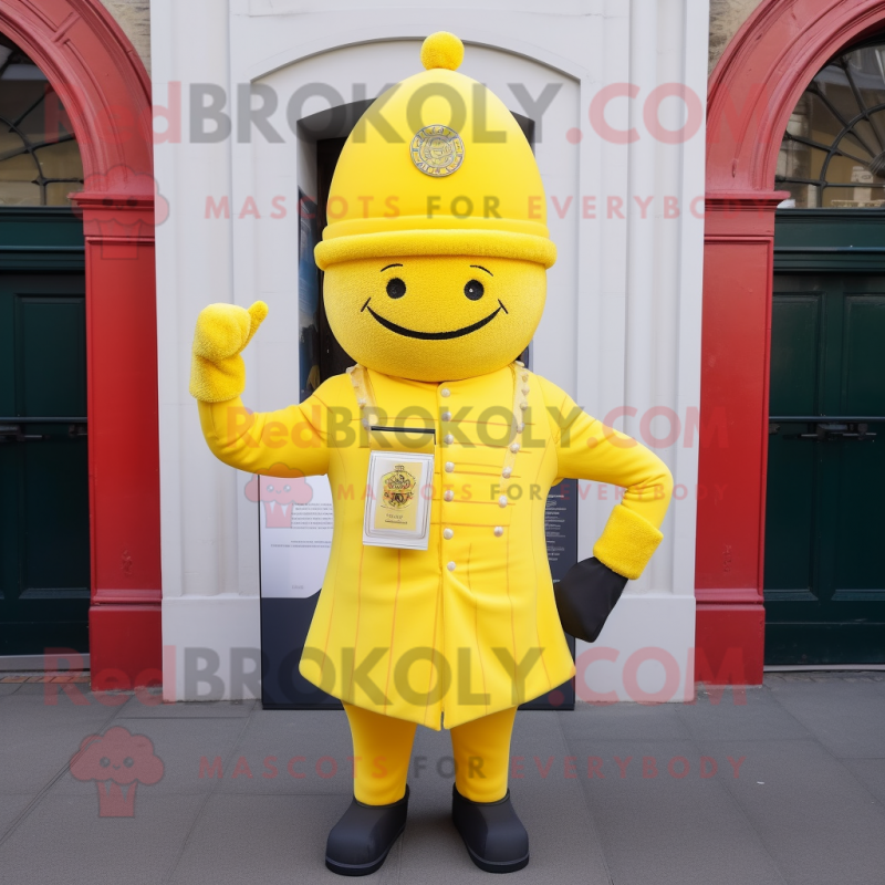 Lemon Yellow British Royal Guard mascot costume character dressed with a Sweater and Hat pins Lemon Yellow British Royal Guard mascot costume character dressed with a Sweater and Hat pins