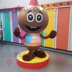 Brown Gumball Machine mascot costume character dressed with a Yoga Pants and Tie pins