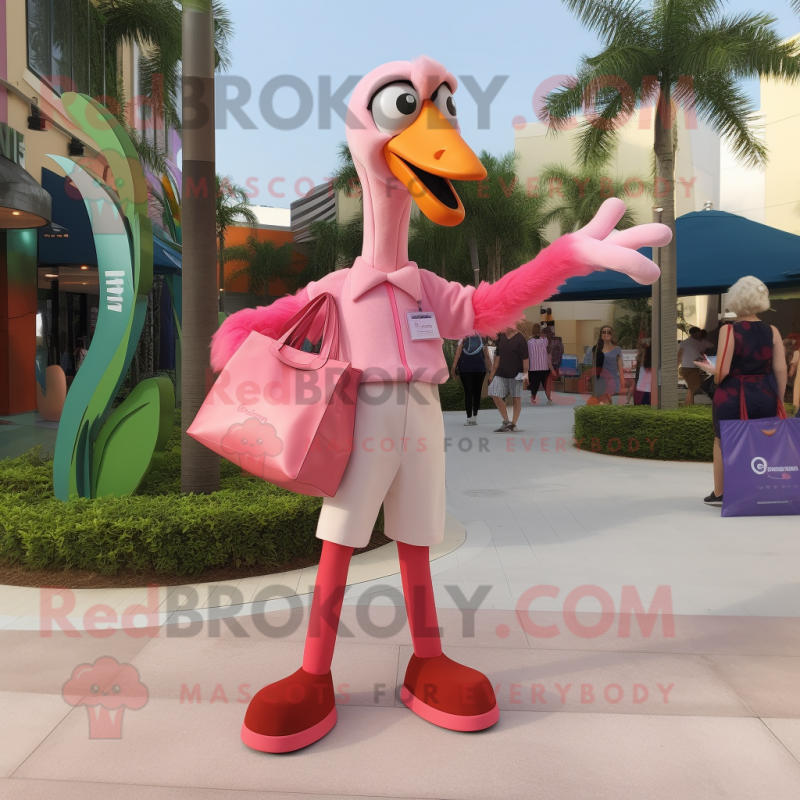 Pink Flamingo mascot costume character dressed with a Chinos and Handbags