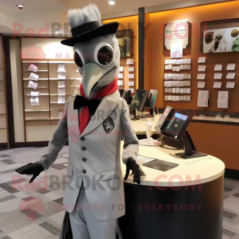 Silver Woodpecker mascot costume character dressed with a Suit and Suspenders