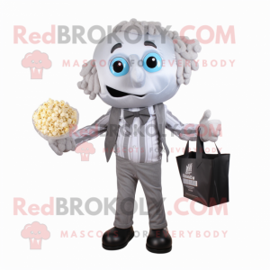 Silver Pop Corn mascot costume character dressed with a Poplin Shirt and Handbags