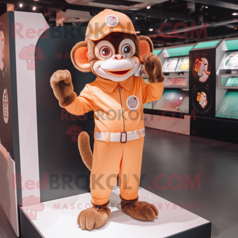 Peach Monkey mascot costume character dressed with a Jumpsuit and Brooches Peach Monkey mascot costume character dressed with a Jumpsuit and Brooches