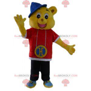 Mascotte orso giallo vestito con un abito rapper hip-hop -