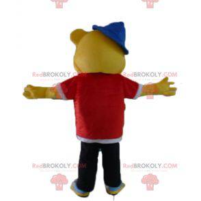 Mascote do urso amarelo vestido com roupa de rapper hip-hop -