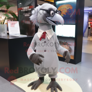 Gray Dodo Bird mascot costume character dressed with a Dress Pants and Reading glasses