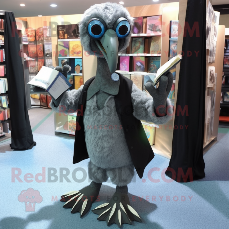 Gray Dodo Bird mascot costume character dressed with a Dress Pants and Reading glasses Gray Dodo Bird mascot costume character dressed with a Dress Pants and Reading glasses