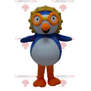 Blauwe en witte vogel mascotte met een vliegerhelm -