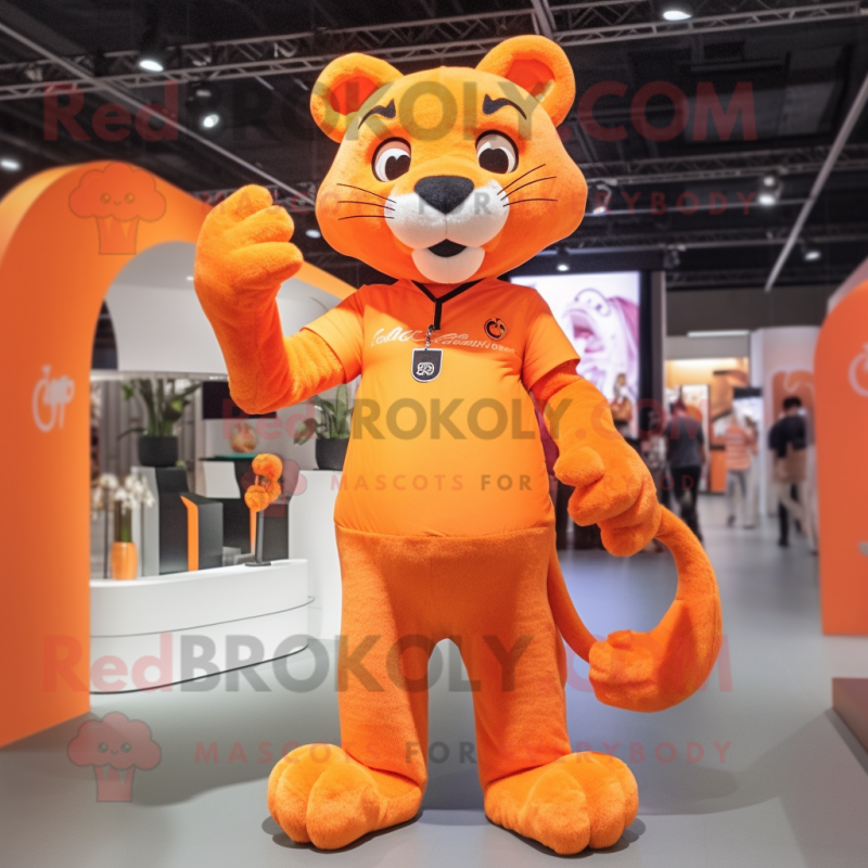 Orange Panther mascot costume character dressed with a Polo Tee and Hair clips Orange Panther mascot costume character dressed with a Polo Tee and Hair clips