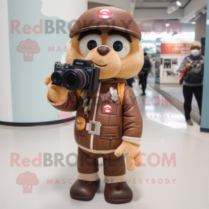 Brown Camera mascot costume character dressed with a Bomber Jacket and Messenger bags