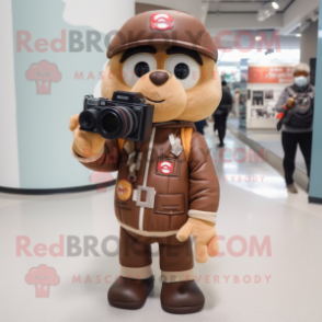 Brown Camera mascot costume character dressed with a Bomber Jacket and Messenger bags