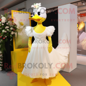 Yellow Geese mascot costume character dressed with a Wedding Dress and Clutch bags
