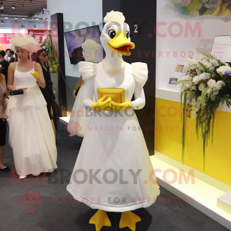 Yellow Geese mascot costume character dressed with a Wedding Dress and Clutch bags Yellow Geese mascot costume character dressed with a Wedding Dress and Clutch bags