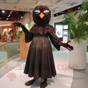 Brown Blackbird mascot costume character dressed with a Evening Gown and Eyeglasses
