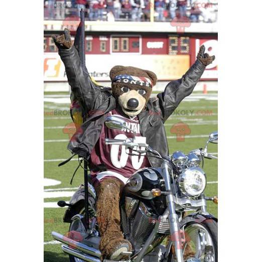 Mascotte d'ours marron avec un bandana et un maillot de sport -