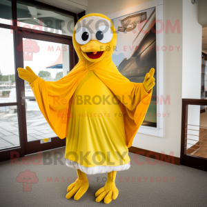 Yellow Seagull mascot costume character dressed with a Dress Pants and Shawls