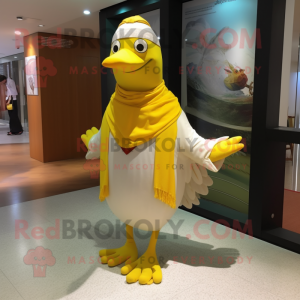 Yellow Seagull mascot costume character dressed with a Dress Pants and Shawls