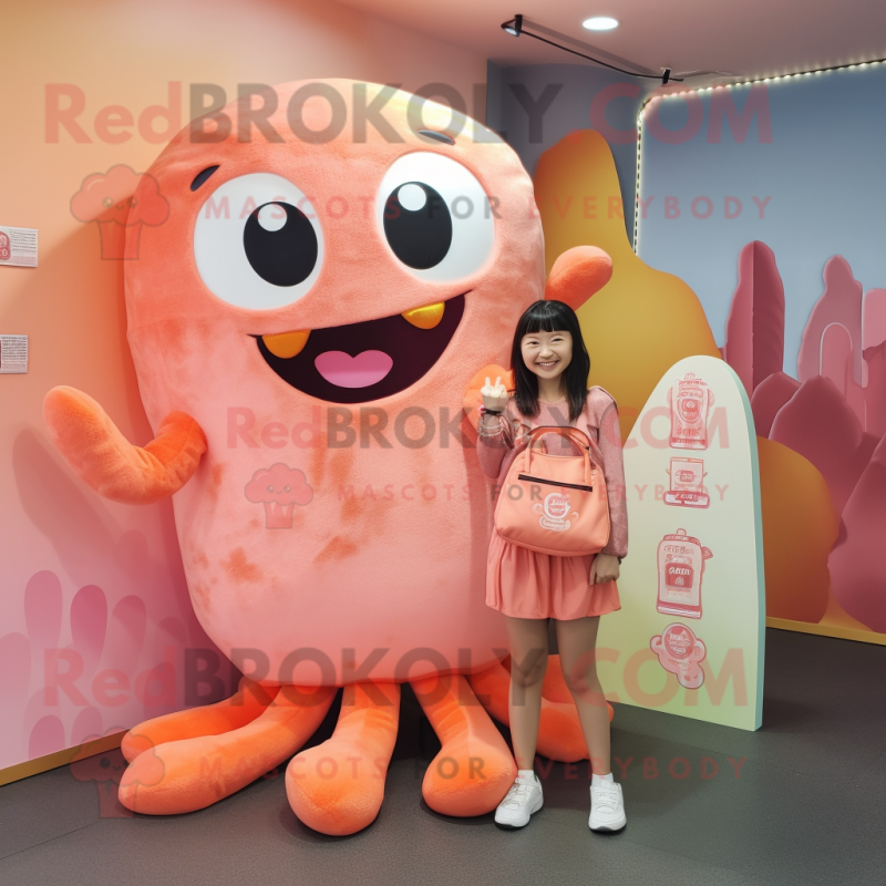 Peach Kraken mascot costume character dressed with a Leggings and Clutch bags Peach Kraken mascot costume character dressed with a Leggings and Clutch bags