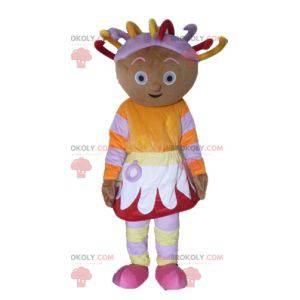 African girl mascot in colorful outfit with dreads -
