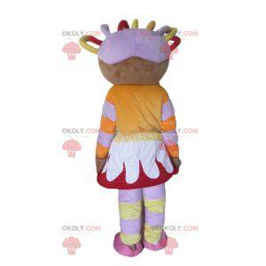 African girl mascot in colorful outfit with dreads -
