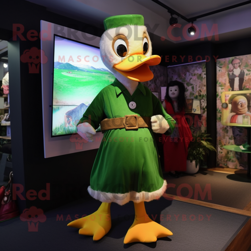 Green Muscovy Duck mascot costume character dressed with a Dungarees and Shawl pins Green Muscovy Duck mascot costume character dressed with a Dungarees and Shawl pins