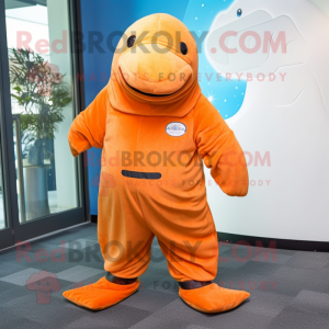 Orange Stellar'S Sea Cow mascot costume character dressed with a Trousers and Ties