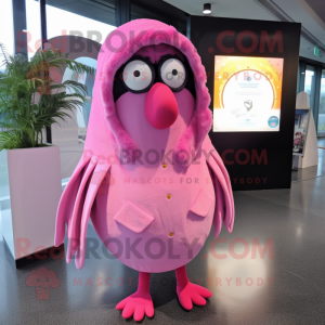 Pink Kiwi mascot costume character dressed with a Raincoat and Shawl pins