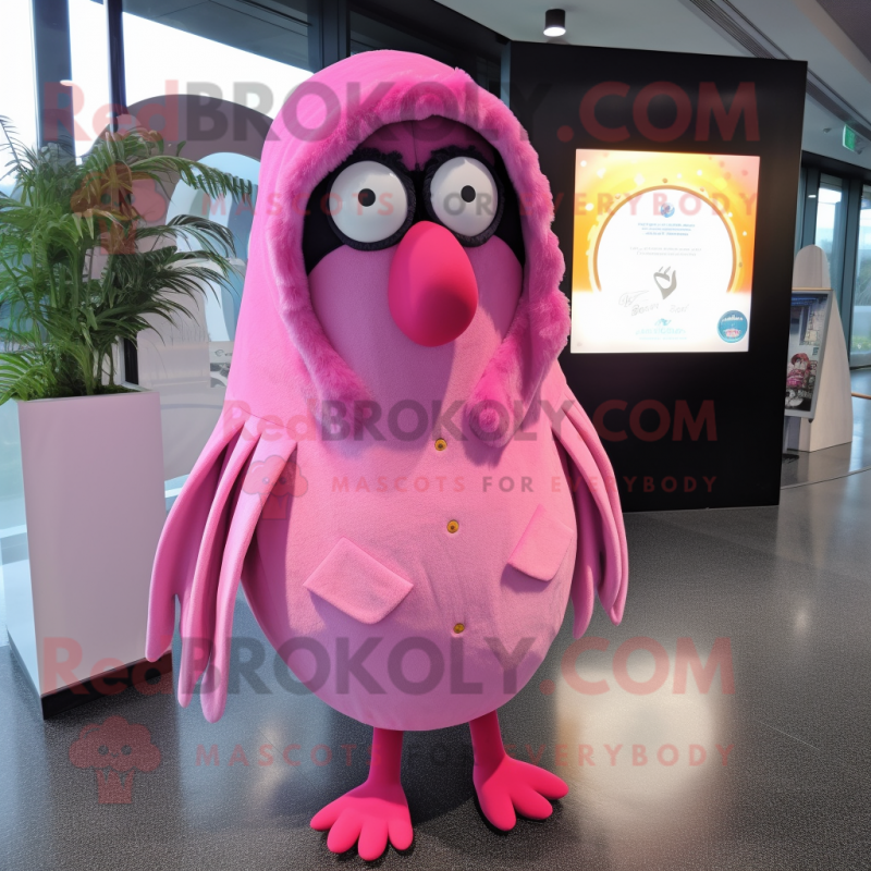 Pink Kiwi mascot costume character dressed with a Raincoat and Shawl pins Pink Kiwi mascot costume character dressed with a Raincoat and Shawl pins