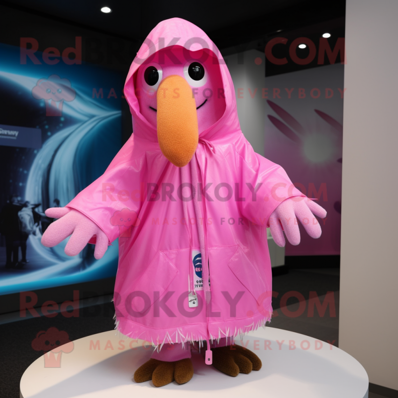 Pink Kiwi mascot costume character dressed with a Raincoat and Shawl pins