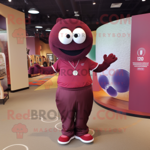Maroon Golf Ball mascot costume character dressed with a Yoga Pants and Messenger bags