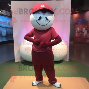 Maroon Golf Ball mascot costume character dressed with a Yoga Pants and Messenger bags