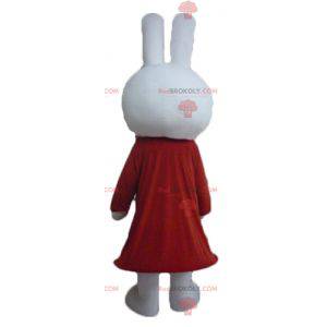 Mascota de conejo blanco de peluche vestida de rojo -