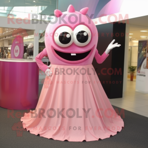 Pink Cyclops mascot costume character dressed with a Maxi Skirt and Rings