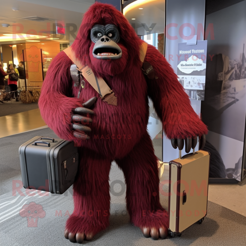 Maroon Sasquatch mascot costume character dressed with a Rash Guard and Briefcases Maroon Sasquatch mascot costume character dressed with a Rash Guard and Briefcases