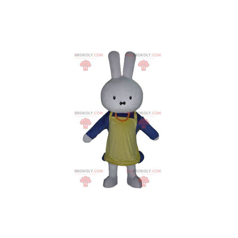 White rabbit mascot dressed in blue with an apron -
