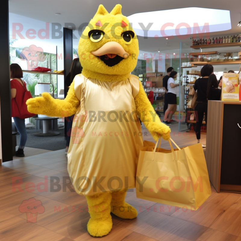Gold Fried Chicken mascot costume character dressed with a A-Line Dress and Tote bags