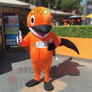 Orange Killer Whale mascot costume character dressed with a Playsuit and Wallets